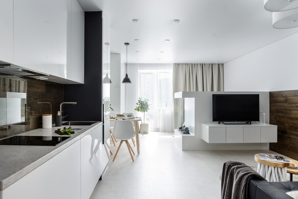 This is an example of a small contemporary single-wall open plan kitchen in Novosibirsk with white floor, an undermount sink, flat-panel cabinets, brown splashback, glass sheet splashback, no island, grey benchtop and laminate benchtops.