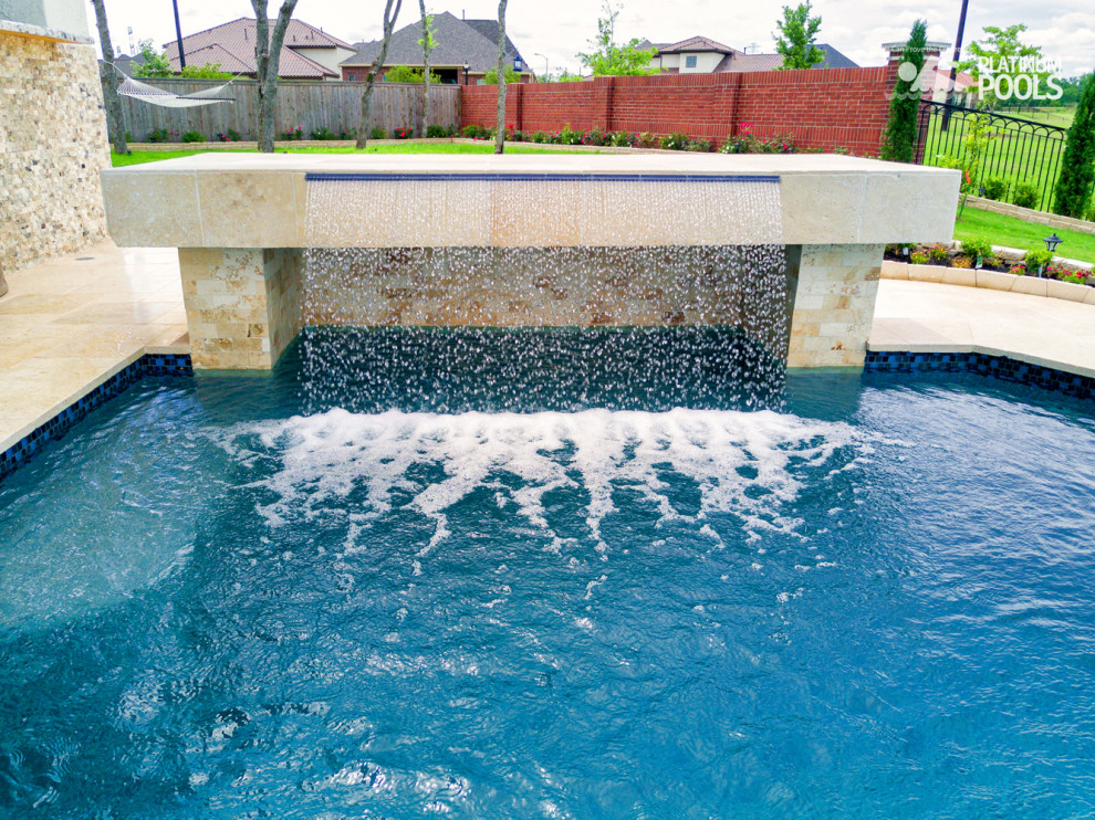 Inspiration for a contemporary backyard custom-shaped pool.