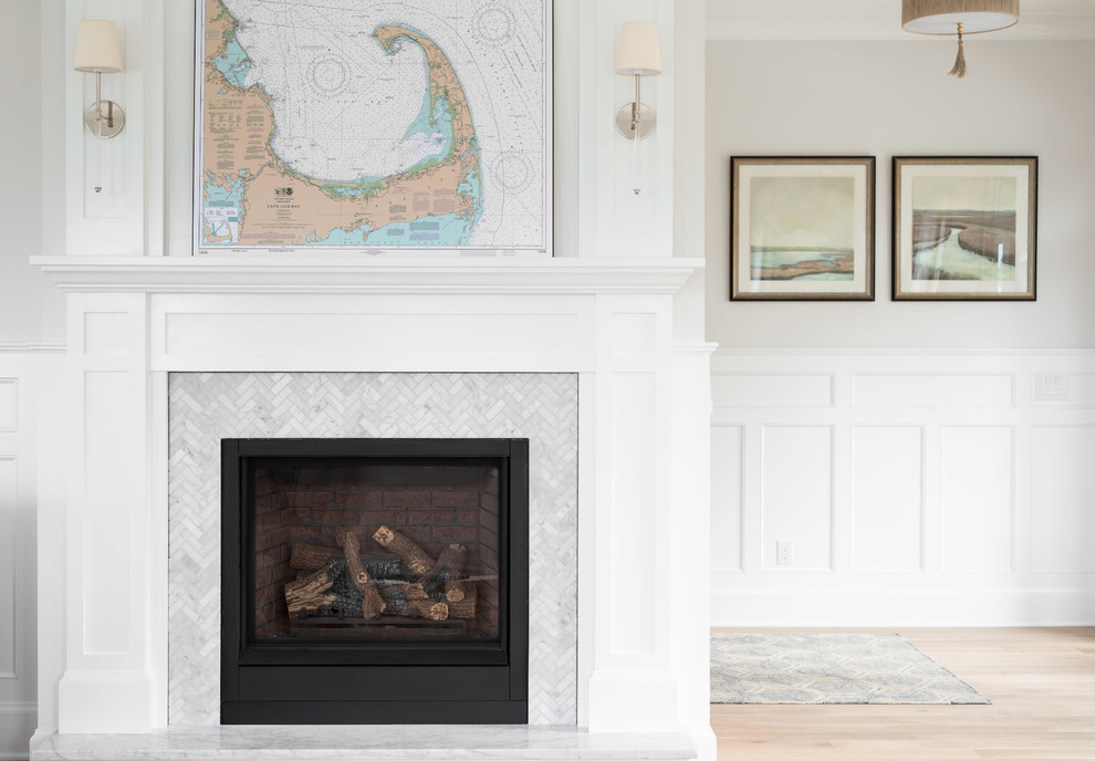 Transitional home design photo with a tile fireplace
