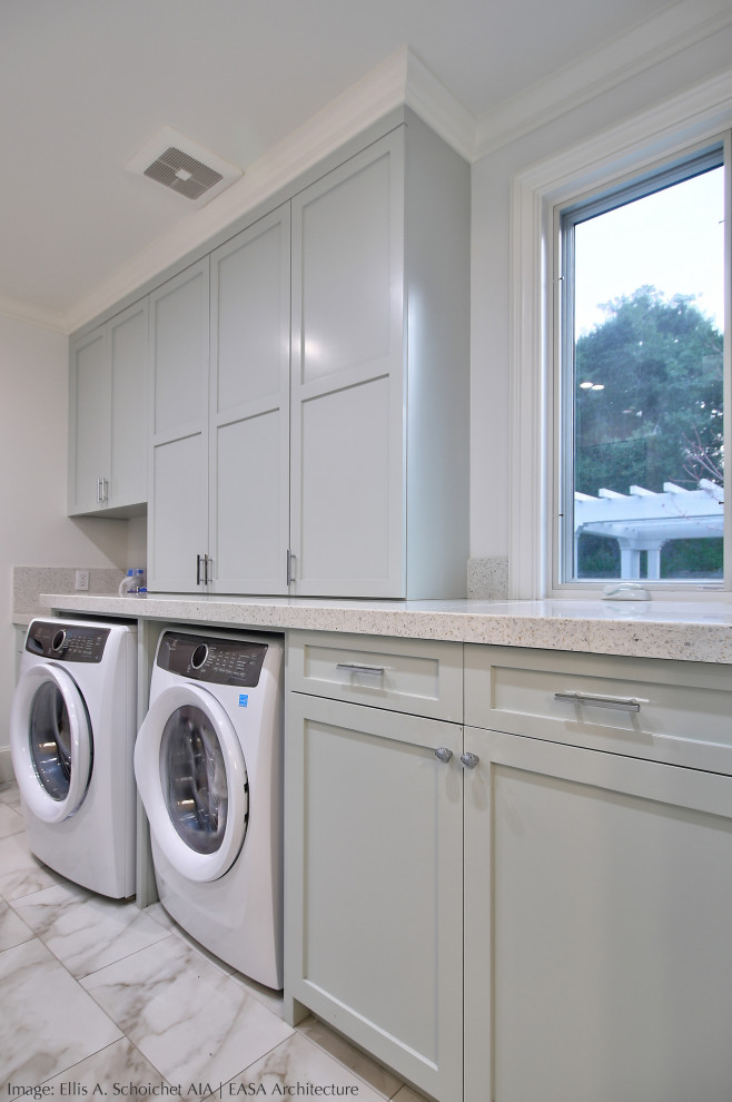 Inspiration for a large traditional galley utility room in San Francisco with recessed-panel cabinets, grey cabinets, beige splashback, white walls, a side by side washer and dryer, white floors, beige worktops, terrazzo worktops and porcelain flooring.
