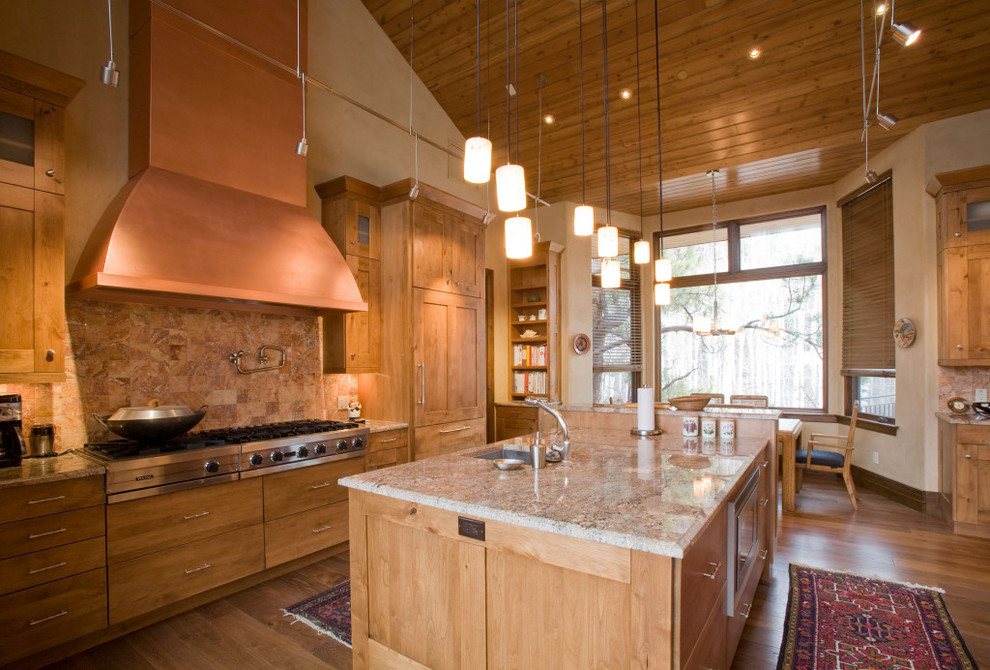 U-shaped light wood floor kitchen photo in Denver with an undermount sink, shaker cabinets, light wood cabinets, stainless steel appliances and an island