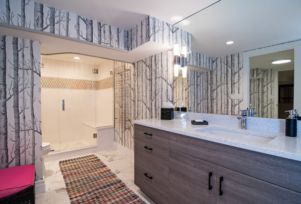 This is an example of a contemporary bathroom in Chicago with flat-panel cabinets, dark wood cabinets, an open shower, porcelain floors and an integrated sink.