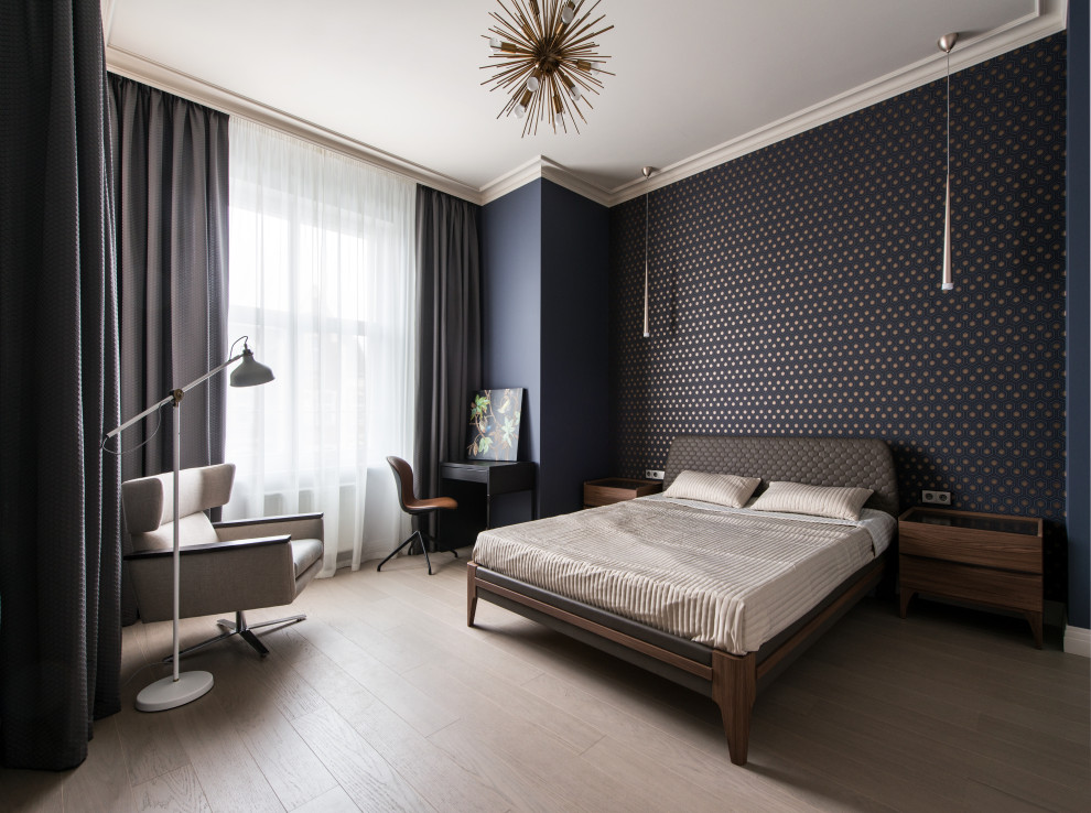 This is an example of a contemporary master bedroom in Moscow with black walls, light hardwood floors and beige floor.