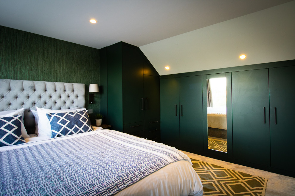 Inspiration for a medium sized contemporary master bedroom in Cambridgeshire with green walls, carpet and beige floors.
