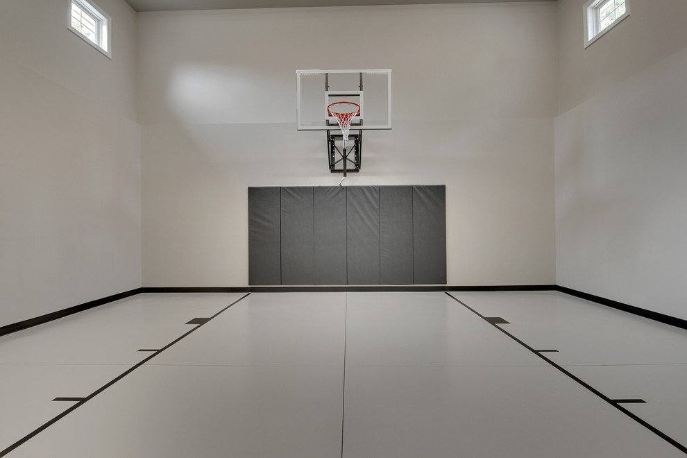 Photo of a large transitional indoor sport court in Minneapolis with grey walls and concrete floors.