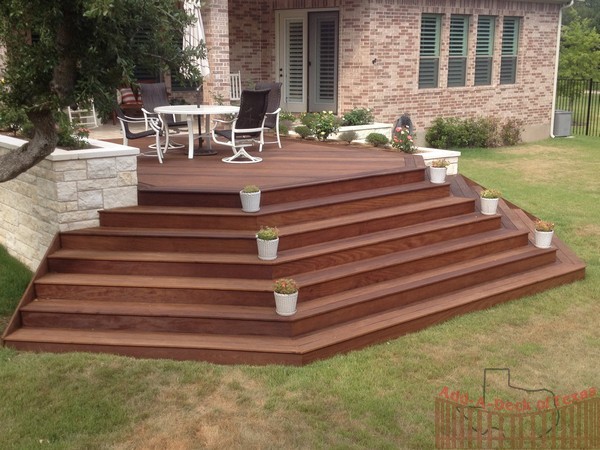 Ipe Hardwood Decking with Metal Framing, Limestone Flower Beds around ...