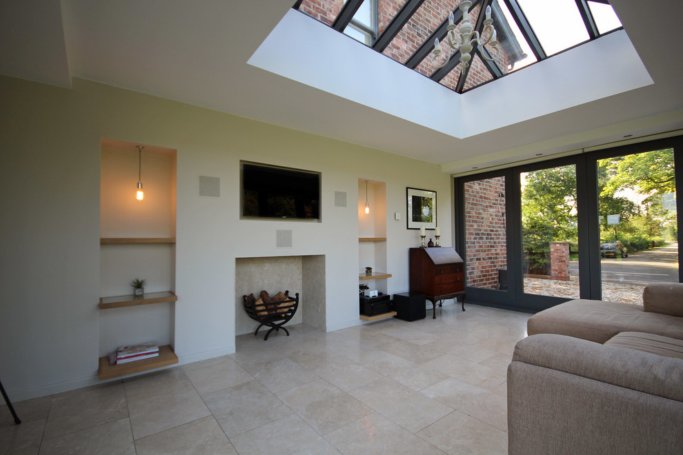 Inspiration for a contemporary family room in Manchester with white walls, limestone floors and a wall-mounted tv.