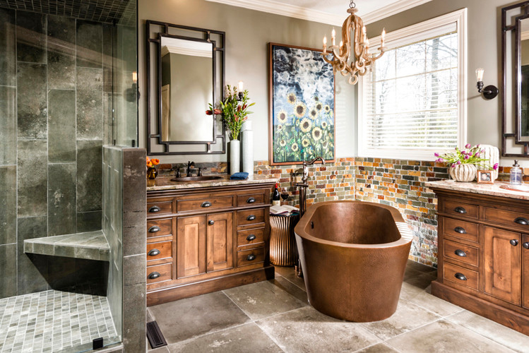 Inspiration for a large transitional master bathroom in Other with a drop-in sink, recessed-panel cabinets, medium wood cabinets, granite benchtops, a freestanding tub, multi-coloured tile, porcelain tile, grey walls and porcelain floors.