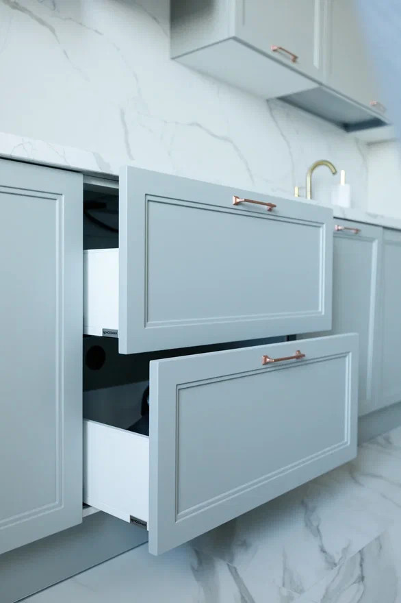 This is an example of a medium sized classic grey and white single-wall enclosed kitchen in Moscow with shaker cabinets, green cabinets, engineered stone countertops, white splashback, ceramic splashback, black appliances, porcelain flooring, no island, white floors, white worktops, a drop ceiling and a submerged sink.