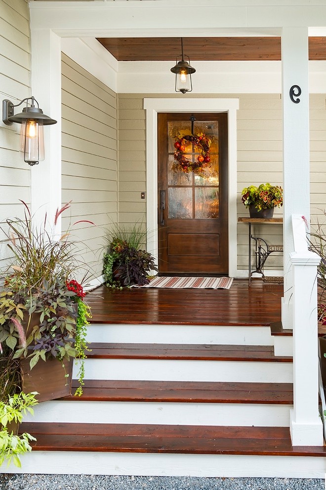 Design ideas for a country entryway in DC Metro with a single front door and a dark wood front door.