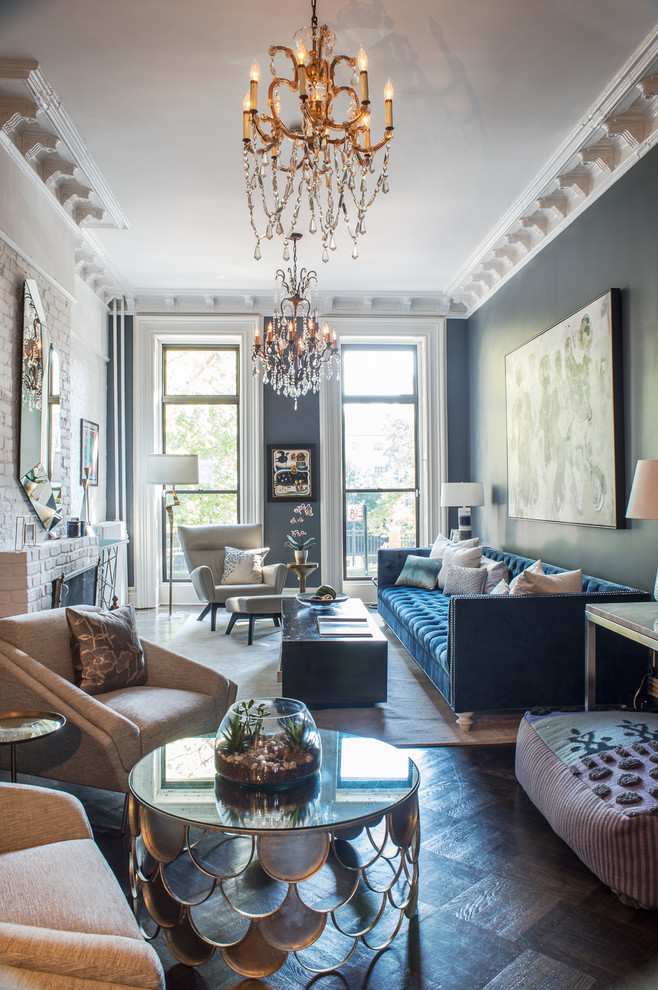 This is an example of a mid-sized eclectic open concept living room in New York with grey walls, dark hardwood floors, a standard fireplace, a brick fireplace surround, no tv and black floor.