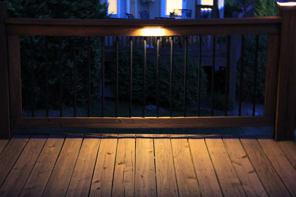 Deck lighting using low under railing LED lights american-traditional-terrace