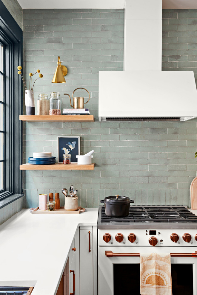 Eat-in kitchen - mid-sized 1950s u-shaped eat-in kitchen idea in Tampa with green backsplash and brick backsplash
