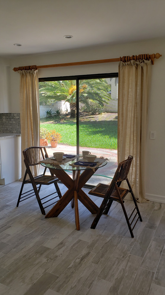 Inspiration for a transitional dining room remodel in Orange County