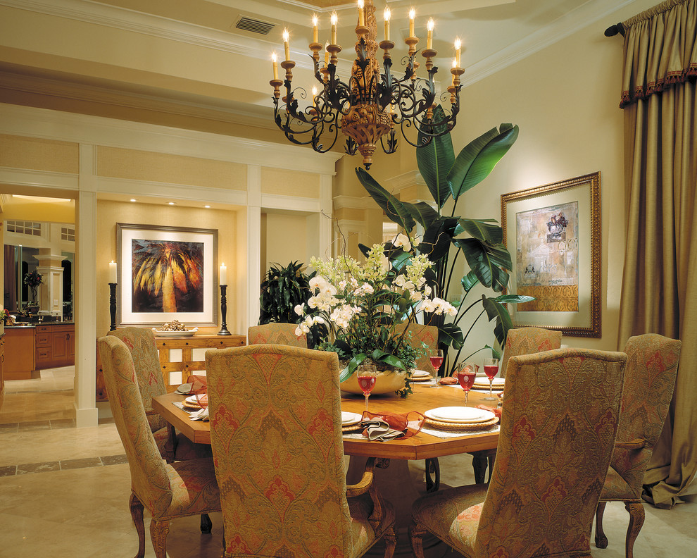 Photo of a large mediterranean separate dining room in Miami with beige walls, travertine floors and no fireplace.