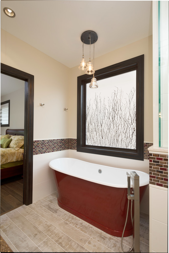 Large country bathroom in Vancouver with a freestanding tub, multi-coloured tile, glass tile, white walls and porcelain floors.