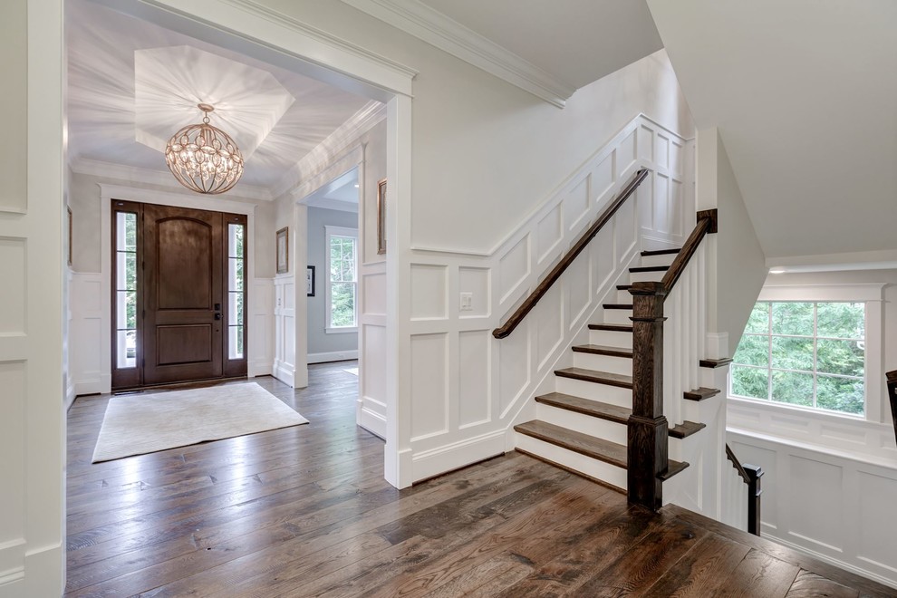 Design ideas for a mid-sized transitional wood u-shaped staircase in DC Metro with painted wood risers.