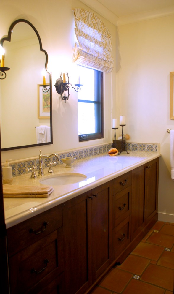This is an example of a large transitional 3/4 bathroom in San Diego with shaker cabinets, medium wood cabinets, an alcove shower, mosaic tile, white walls, terra-cotta floors, an undermount sink and marble benchtops.