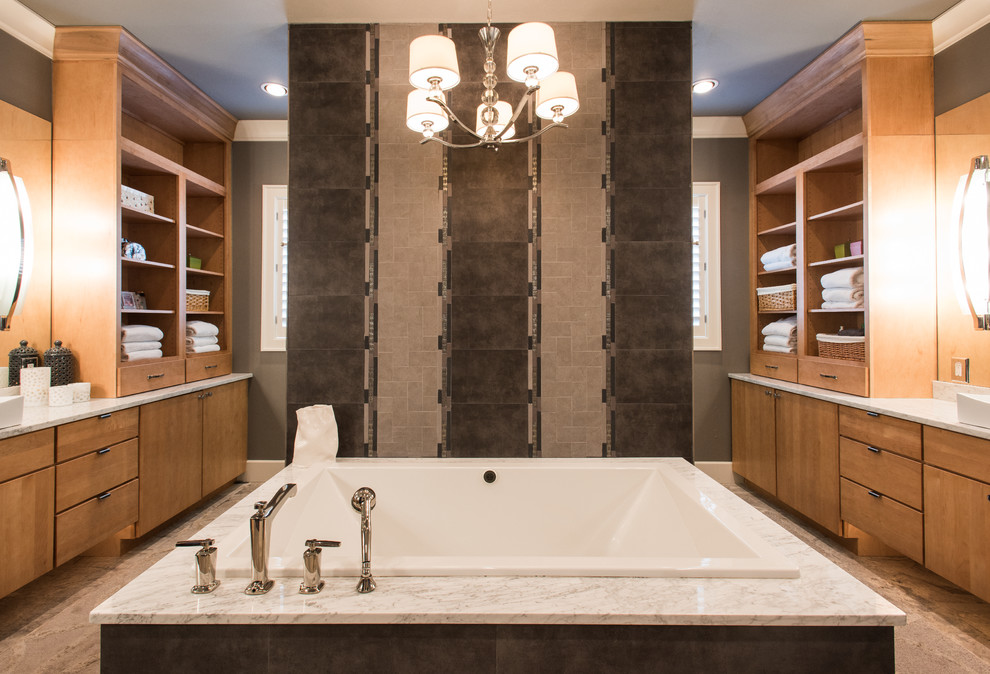 Drop-in bathtub - large transitional master drop-in bathtub idea with flat-panel cabinets, light wood cabinets and a vessel sink