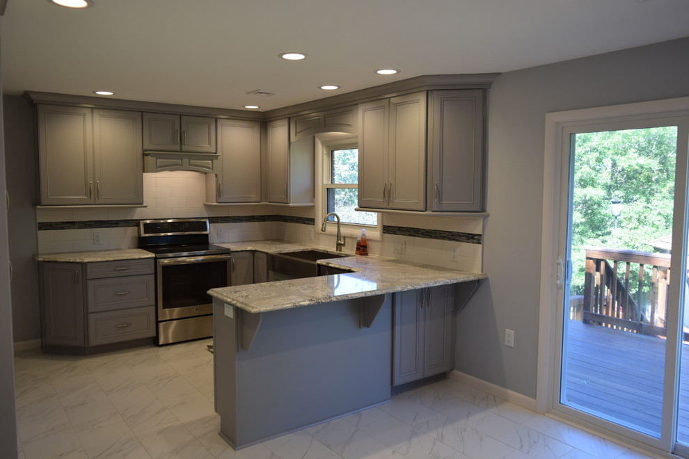 Inspiration for a transitional ceramic tile kitchen remodel with beaded inset cabinets, gray cabinets, quartz countertops, white backsplash, subway tile backsplash and stainless steel appliances