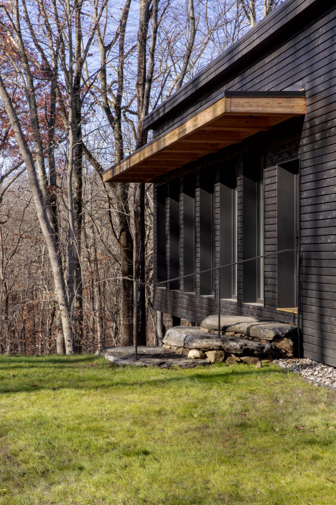 Foto de fachada de casa marrón minimalista de tamaño medio de una planta con tejado plano