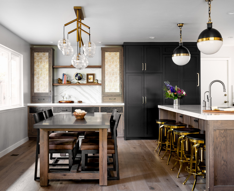 Eat-in kitchen - mid-sized eclectic l-shaped medium tone wood floor and brown floor eat-in kitchen idea with an undermount sink, recessed-panel cabinets, dark wood cabinets, quartz countertops, white backsplash, quartz backsplash, paneled appliances, an island and white countertops