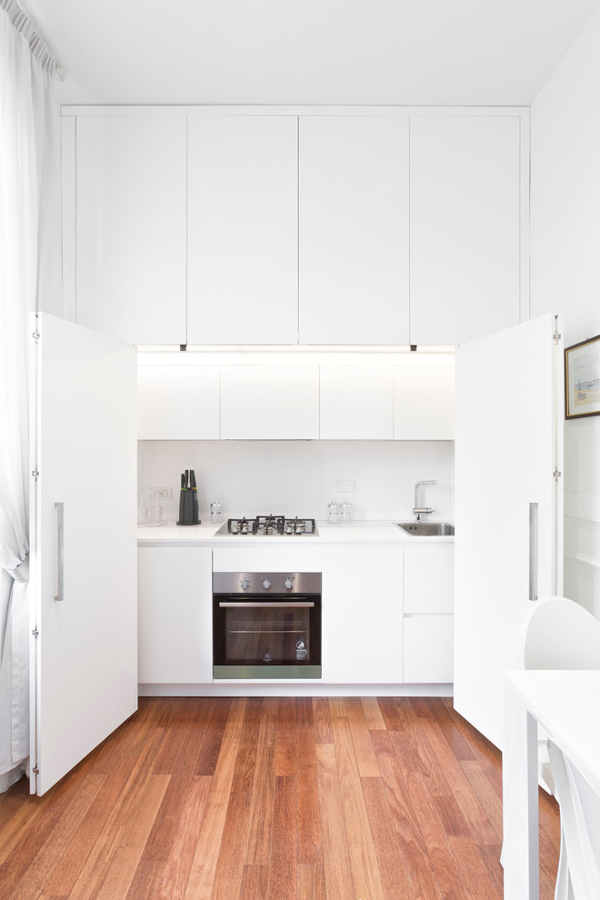 This is an example of a small contemporary kitchen in Milan.