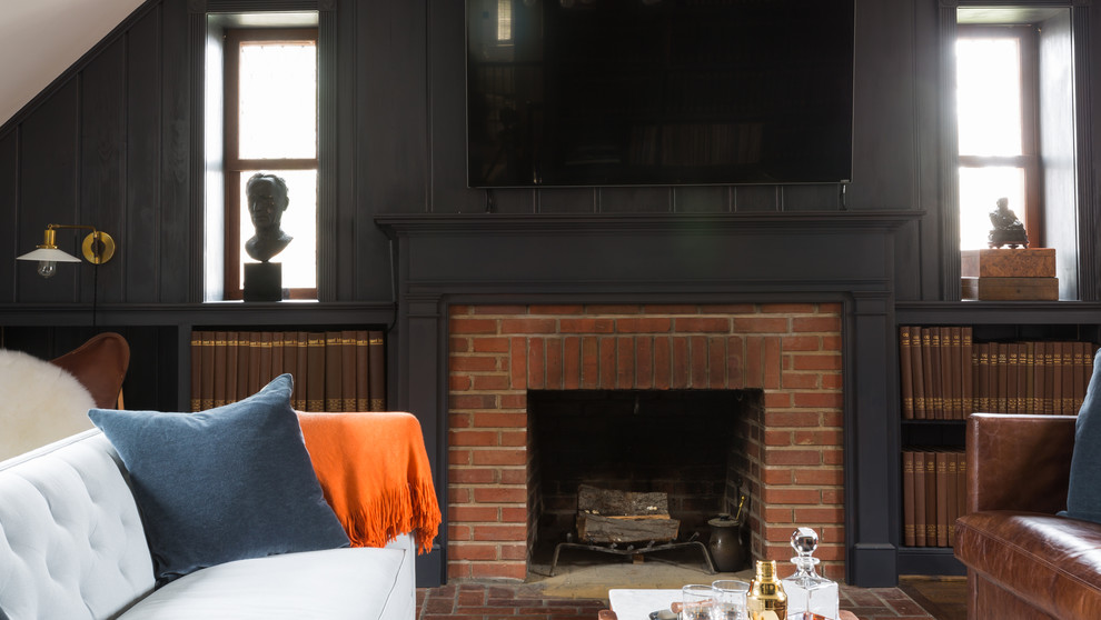 This is an example of a midcentury family room in DC Metro with blue walls, dark hardwood floors, a standard fireplace, a brick fireplace surround and a wall-mounted tv.