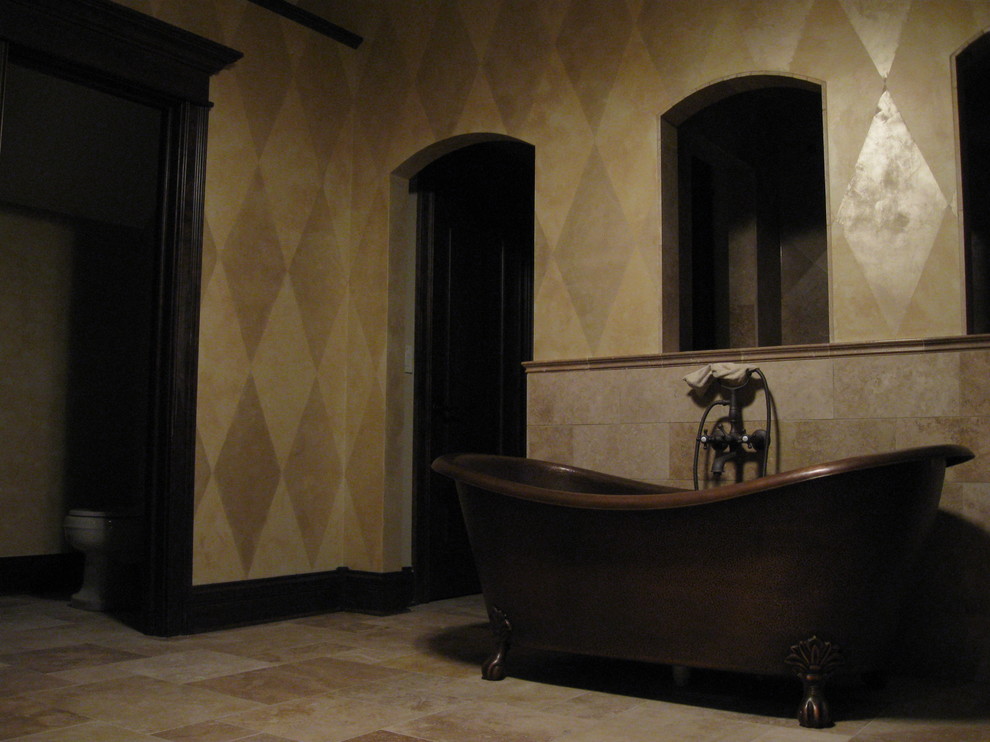 Design ideas for a large traditional master bathroom in Chicago with a claw-foot tub, an open shower, a one-piece toilet, beige tile, stone tile, multi-coloured walls and travertine floors.