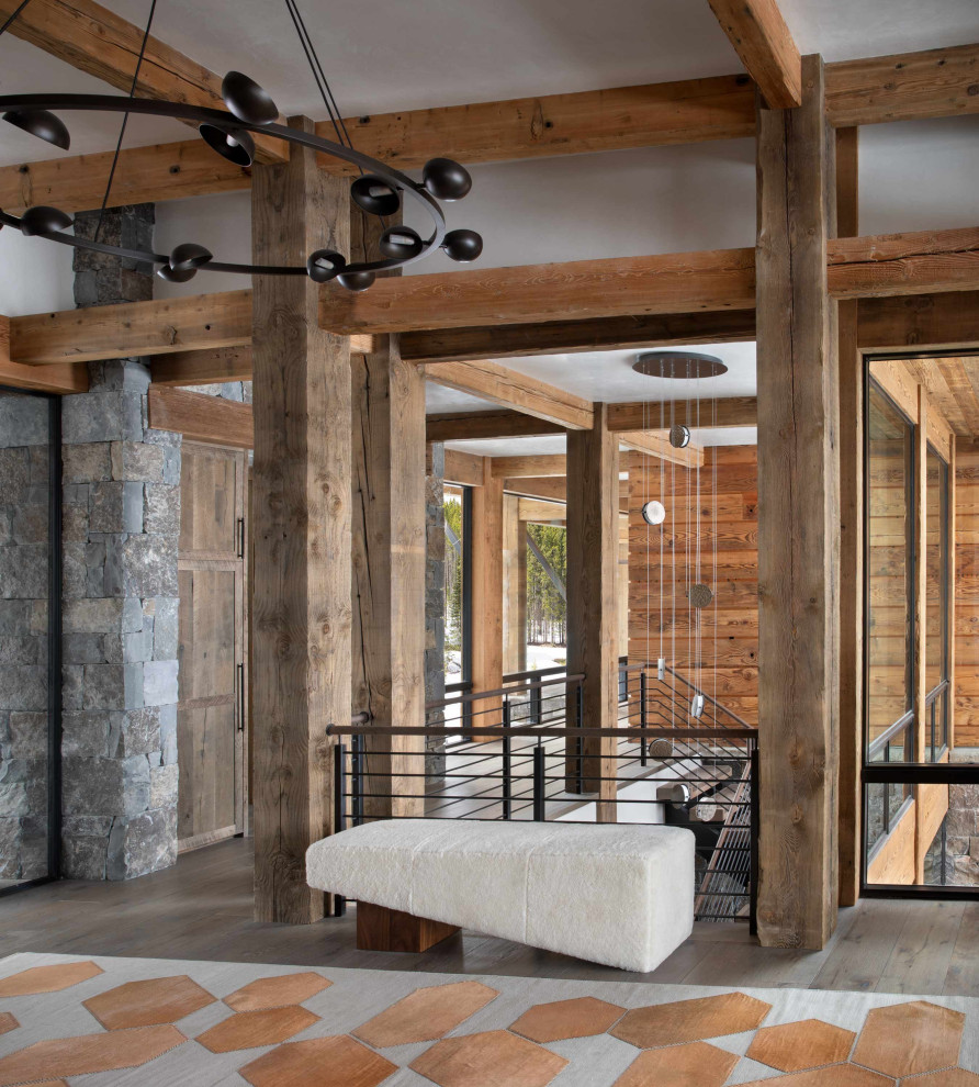 Inspiration for a rustic dark wood floor entryway remodel