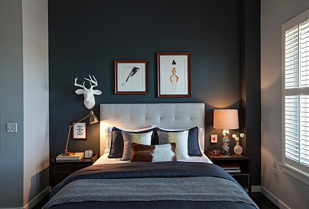Photo of a contemporary bedroom in Chicago with black walls.