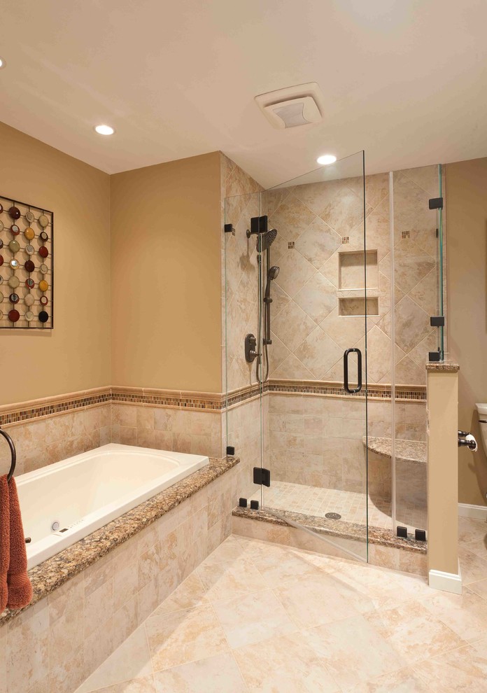 Design ideas for a mid-sized traditional master bathroom in Other with raised-panel cabinets, dark wood cabinets, a corner shower, a two-piece toilet, ceramic tile, beige walls, travertine floors, an undermount sink and granite benchtops.