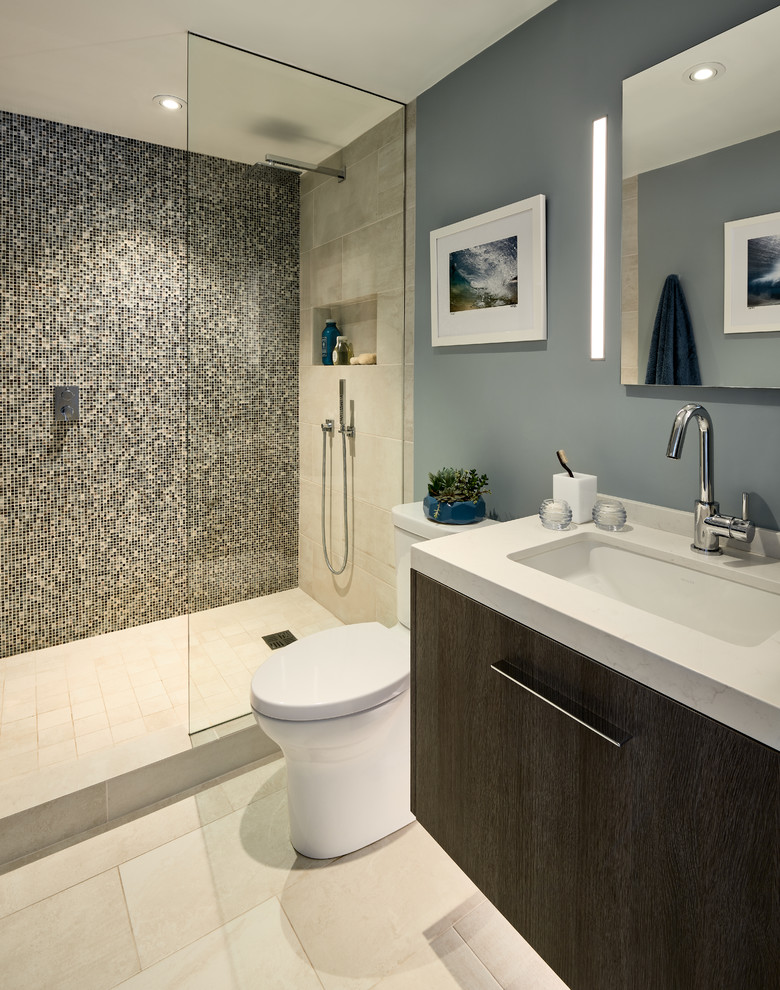 Photo of a small contemporary master bathroom in San Francisco with flat-panel cabinets, distressed cabinets, an open shower, a one-piece toilet, multi-coloured tile, glass tile, blue walls, porcelain floors, an undermount sink, quartzite benchtops, beige floor and an open shower.