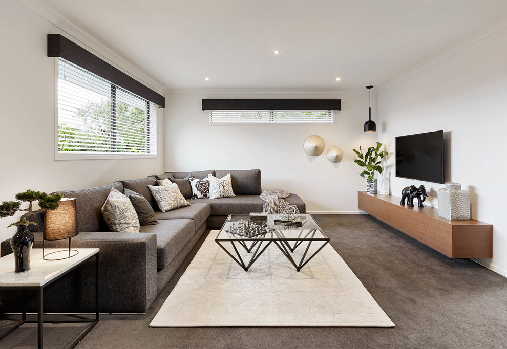 Contemporary family room in Melbourne with white walls, carpet, no fireplace and a wall-mounted tv.