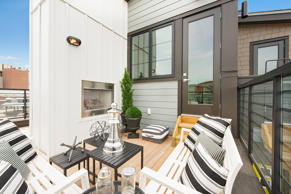 Inspiration for a transitional deck in Calgary with a fire feature and no cover.