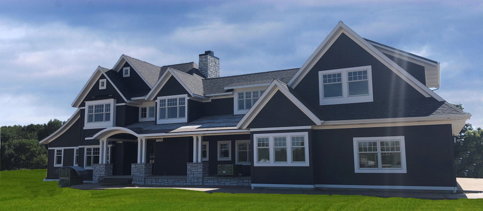 Inspiration for a large modern two-storey grey house exterior in Other with vinyl siding, a gable roof, a shingle roof, a black roof and clapboard siding.