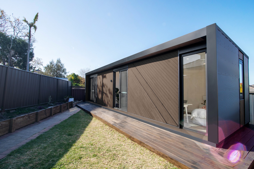 This is an example of a mid-sized contemporary detached granny flat in Sydney.