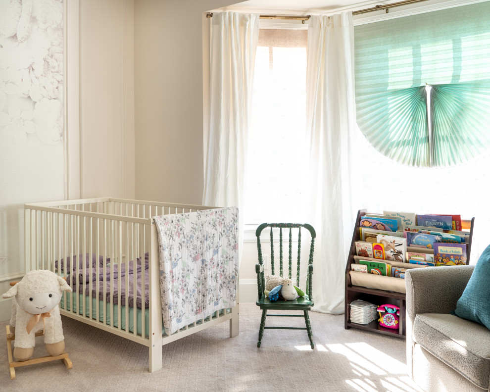 This is an example of a transitional nursery for girls in Toronto with beige walls, carpet and beige floor.