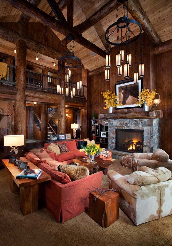 Design ideas for a large country open concept living room in Other with brown walls, a standard fireplace, a stone fireplace surround and carpet.