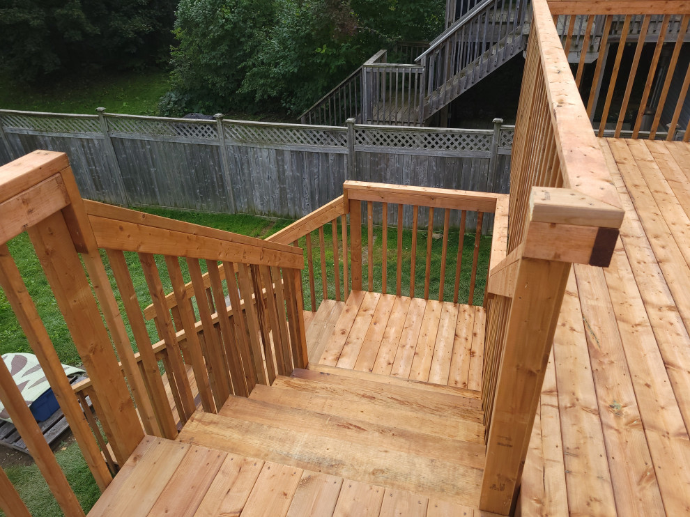 Inspiration for a large modern back first floor wood railing terrace in Ottawa with no cover.