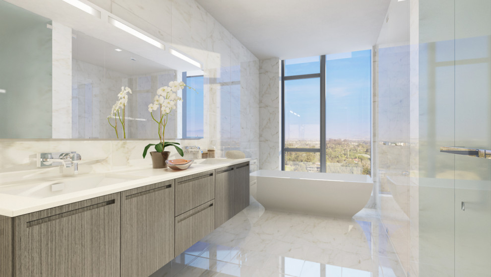 Photo of a large contemporary master bathroom in San Diego with flat-panel cabinets, beige cabinets, a freestanding tub, a curbless shower, a one-piece toilet, multi-coloured tile, glass sheet wall, multi-coloured walls, ceramic floors, an undermount sink, granite benchtops, beige floor, a hinged shower door, white benchtops, a double vanity and a floating vanity.