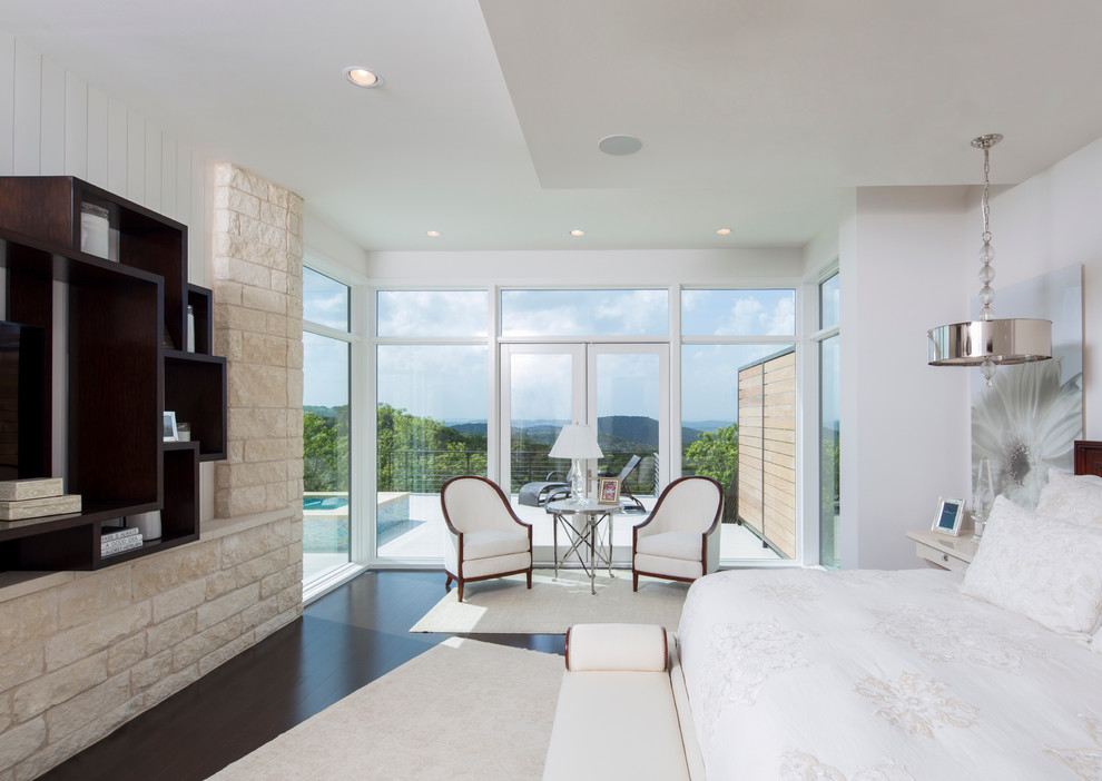 Inspiration for a contemporary master bedroom in Austin with white walls.