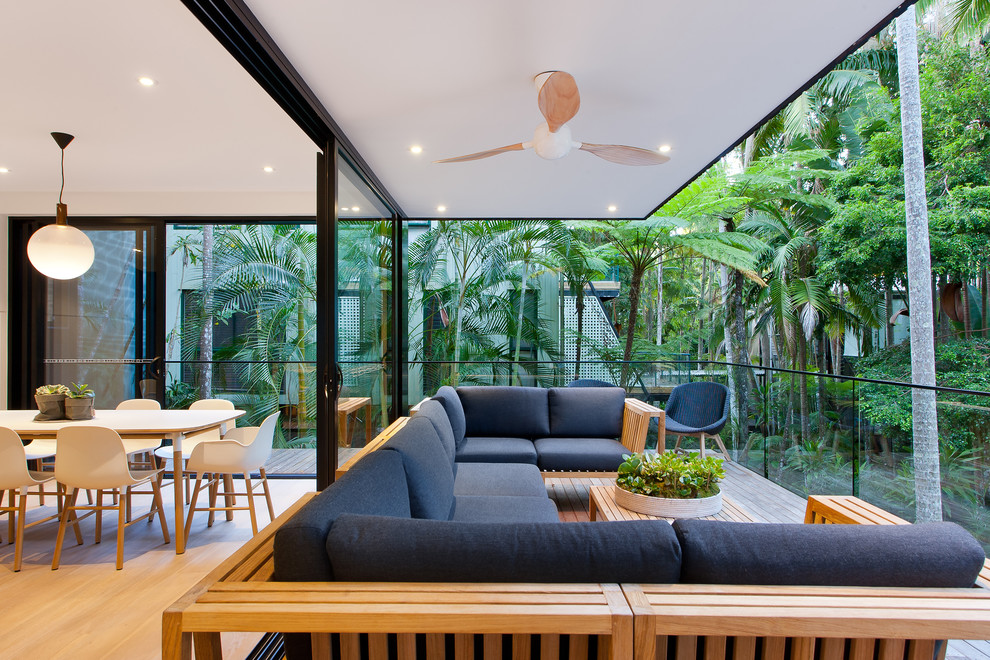 Design ideas for a contemporary deck in Sunshine Coast with a roof extension.
