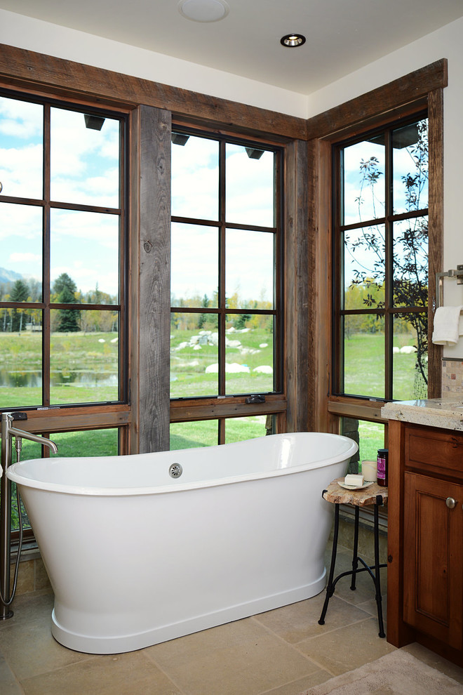 Freestanding bathtub - mid-sized rustic master ceramic tile freestanding bathtub idea with dark wood cabinets, white walls, shaker cabinets and granite countertops