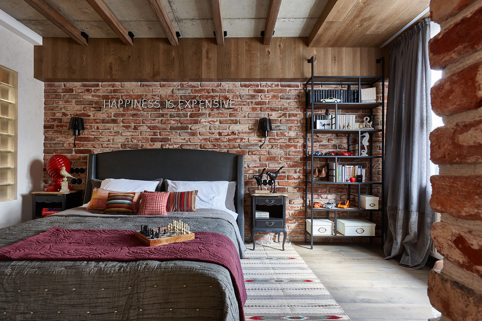 Inspiration for an industrial master bedroom in Moscow with brown walls.