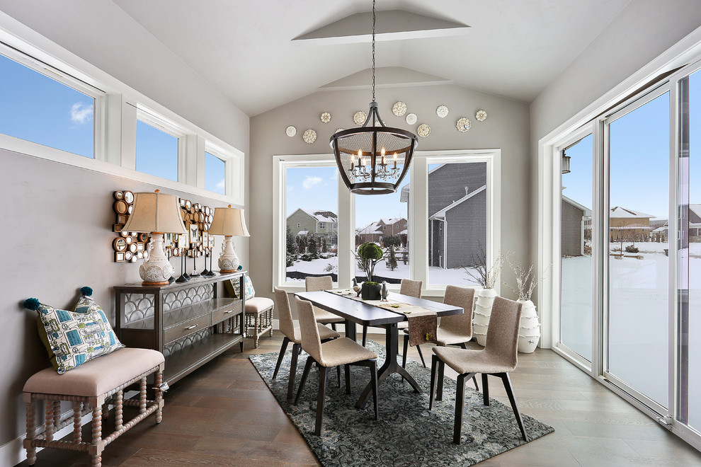 Kitchen/dining room combo - large transitional medium tone wood floor and brown floor kitchen/dining room combo idea with gray walls and no fireplace