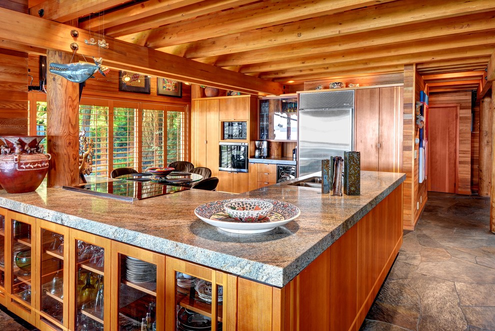 Inspiration for a country u-shaped kitchen in Seattle with granite benchtops, a peninsula, a double-bowl sink, flat-panel cabinets, medium wood cabinets and stainless steel appliances.