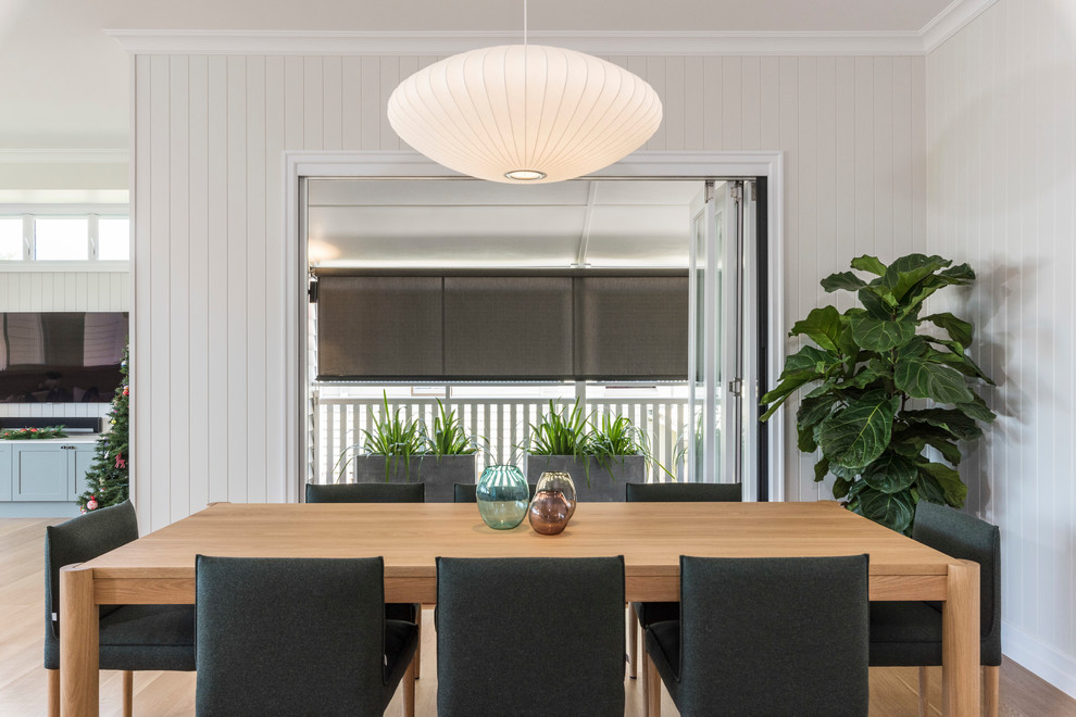 Design ideas for a transitional open plan dining in Brisbane with beige walls, medium hardwood floors and beige floor.