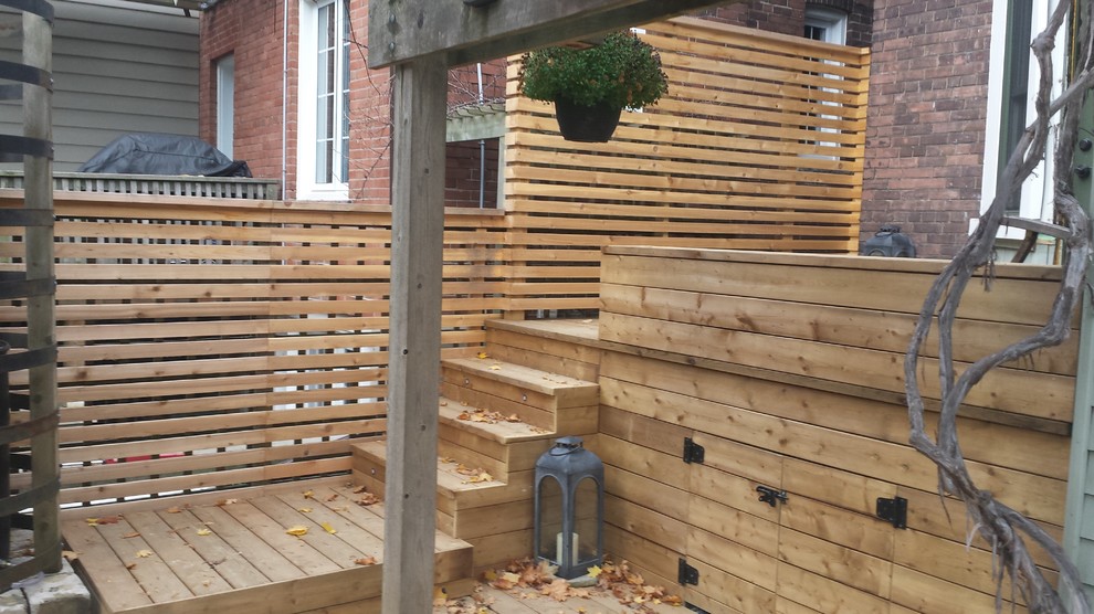 Inspiration for a small modern backyard partial sun outdoor sport court for summer in Toronto with decking.