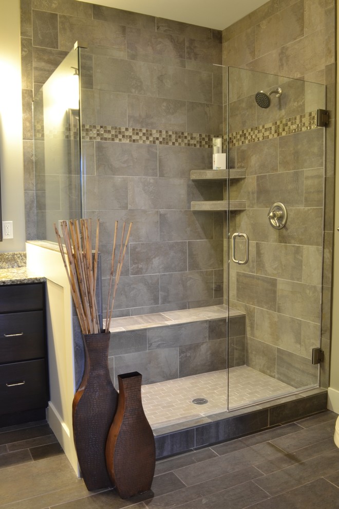 Design ideas for a mid-sized arts and crafts master bathroom in Cincinnati with dark wood cabinets, granite benchtops, gray tile, ceramic tile, grey walls, ceramic floors and a corner shower.